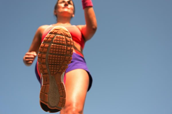 Young woman runner running,training for marathon