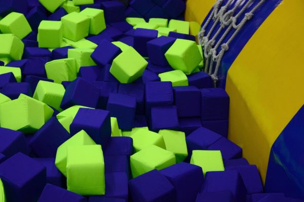 Many colorful soft blocks in a kids' ballpit at a playground