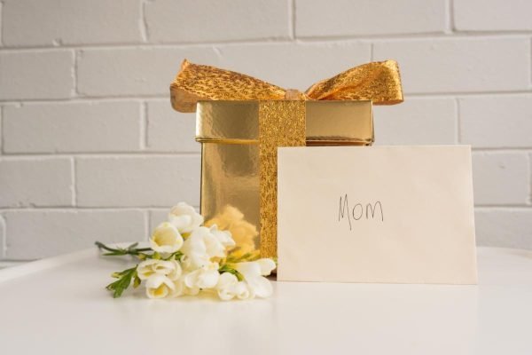Gold box and handwritten envelope for Mother's Day present