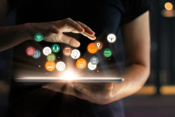 Digital online marketing commerce sale concept. Woman using tablet payments online shopping and icon customer network connection on hologram virtual screen, m-banking and omni channel.