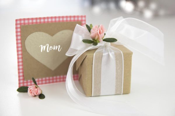 Mother's day gift and card. Lovely box wrapped with ribbon and flowers.